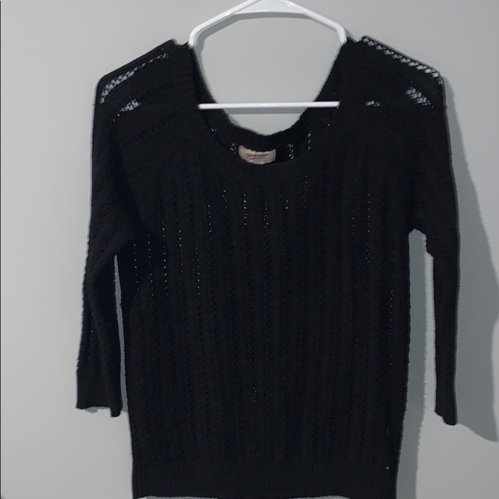 Black knitted sweater.